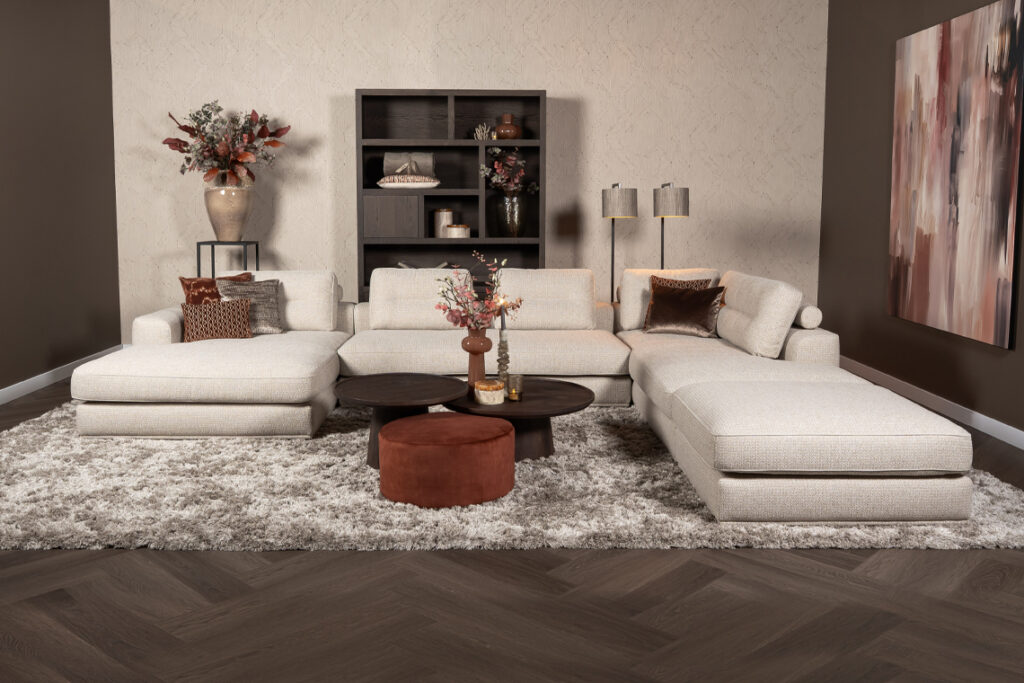 Hoekbank twee liggedeeltes met poef beige stof